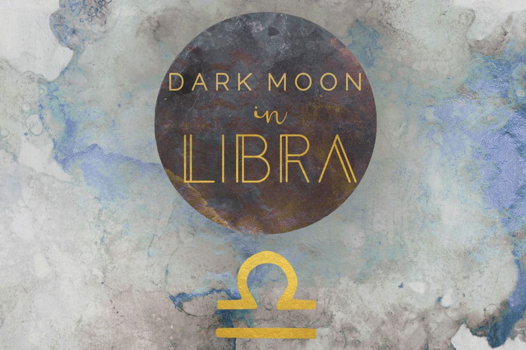 Dark blue watercolor background with a black watercolor moon on the center. The words dark moon in libra are written in gold on the moon, and the libra symbol is below the moon in gold.